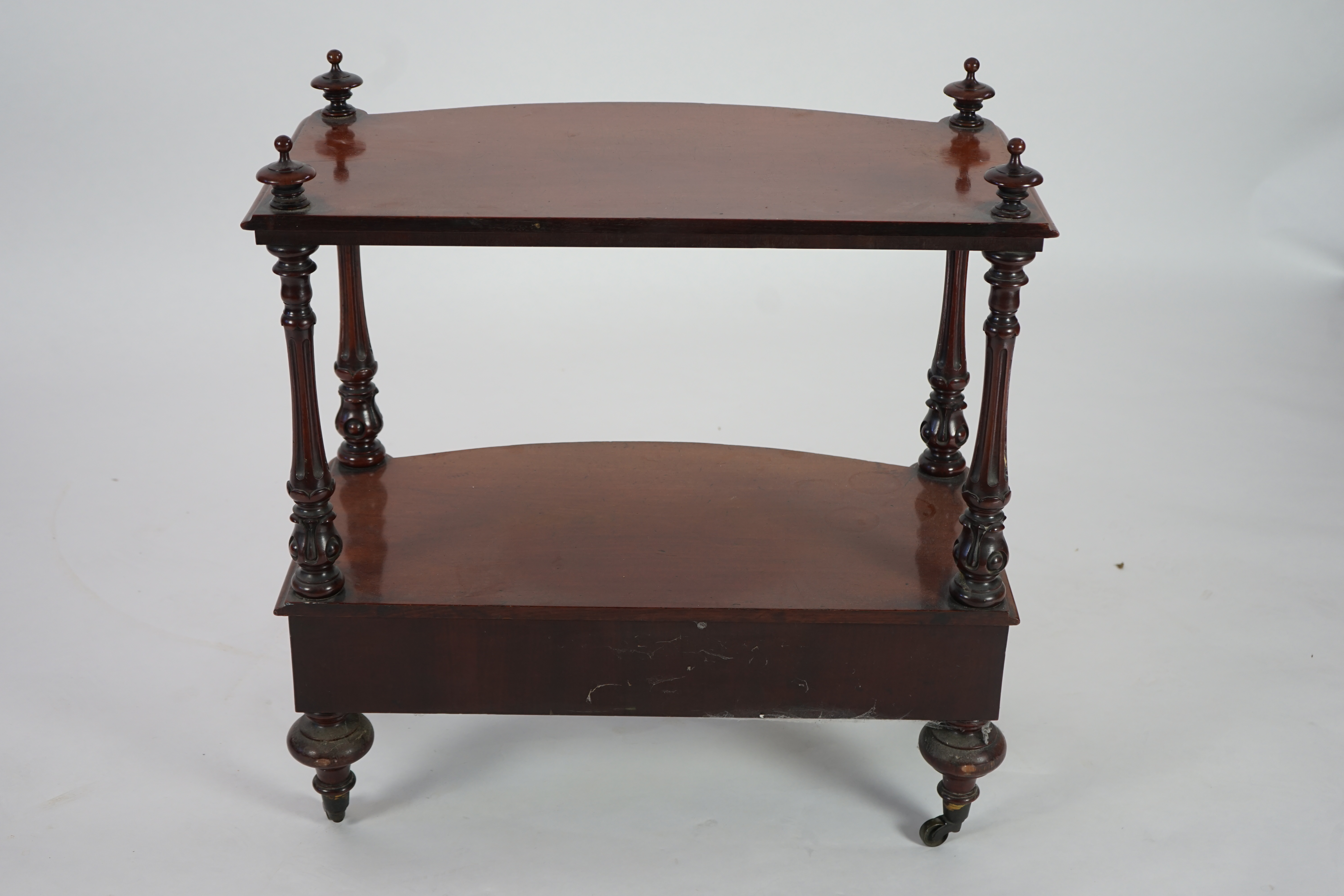 A Victorian mahogany bow fronted two tier whatnot, with fitted drawer, width 66cm, height 73cm. Condition - good